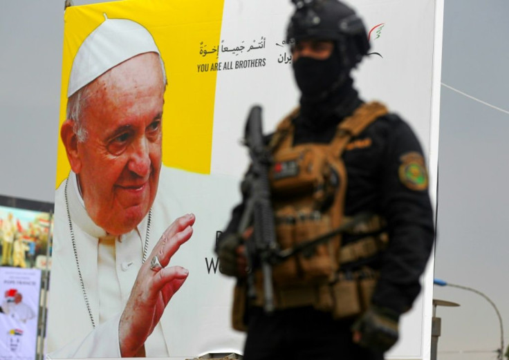 An Iraqi special forces member stands guard outside the Syriac Catholic Church of Our Lady of Deliverance in Baghdad