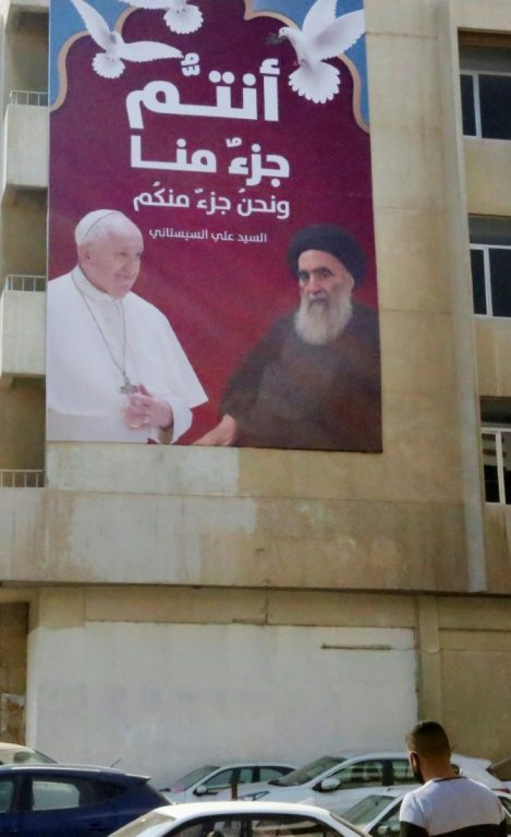A billboard shows Francis and the Grand Ayatollah Ali Sistani, the highly reclusive cleric who is the top religious authority for many of the world's Shiite Muslims