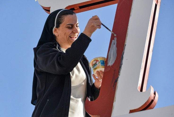 A nun in the predominantly Christian town of Qaraqosh prepares for the highly-anticipated papal visit