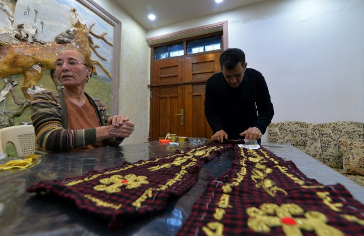 Iraqi priest Ammar Yaqo designed the stole, which is entirely locally produced -- from the fabric to the Syriac prayers hand-stitched along its edges in gold thread