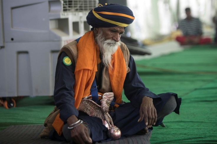 Most Sikhs carry daggers as religious symbols and wear turbans, but Nihangs stand out with their robes and weaponry