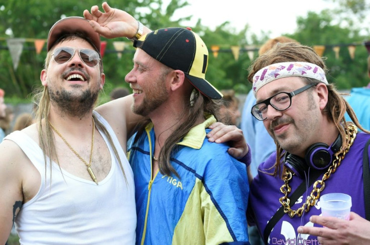 Participants pose during the mullet haircut festival in Boussu in 2019