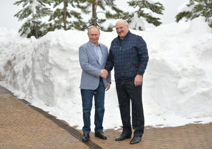 Alexander Lukashenko (R) enjoys strong support from Russia leader Vladimir Putin