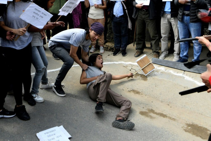Activists from the civil society staged a street play while taking part in a demonstration against the military coup in Myanmar in front of the embassy of Myanmar near Kathmandu on Friday