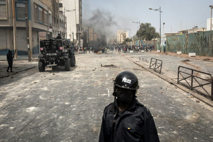 Police officers blocked protesters in Dakar