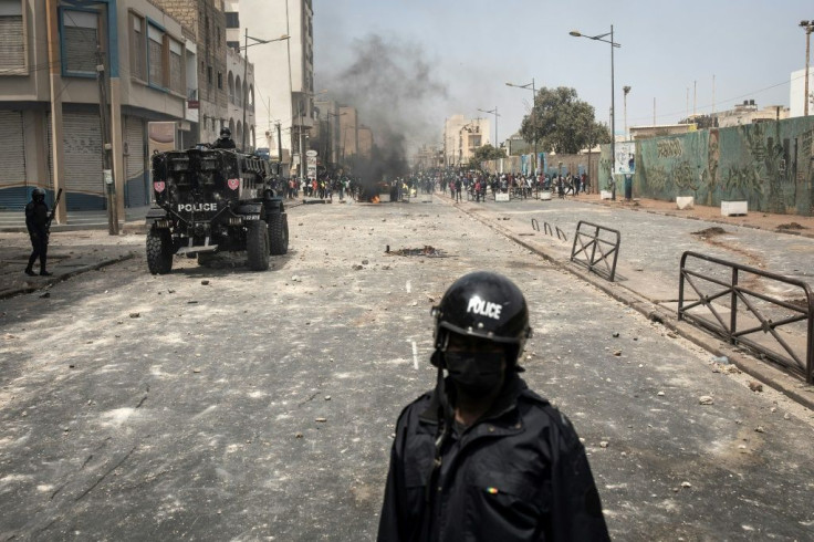 Police officers blocked protesters in Dakar