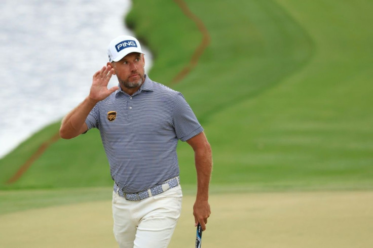 England's Lee Westwood celebrates a birdie at the 18th hole that gave him a one-stroke lead after saturday's third round of the US PGA Arnold Palmer Invitational