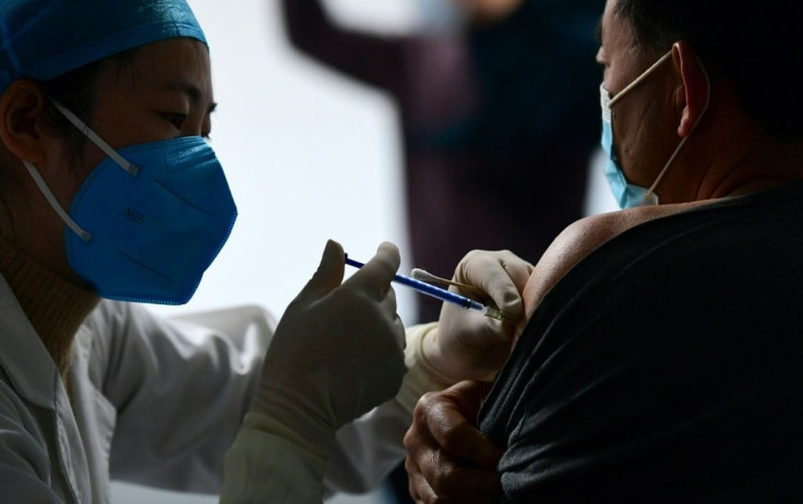 China's current vaccination pace is of "great concern", infectious-disease specialist Zhang Wenhong has said