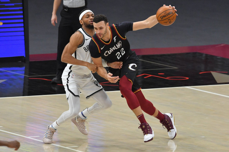  Larry Nance Jr. #22 of the Cleveland Cavaliers drives around Bruce Brown #1 of the Brooklyn Nets 
