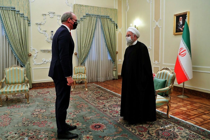 Iran's President Hassan Rouhani (R) receives Irish Foreign Minister Simon Coveney in the capital Tehran on Sunday