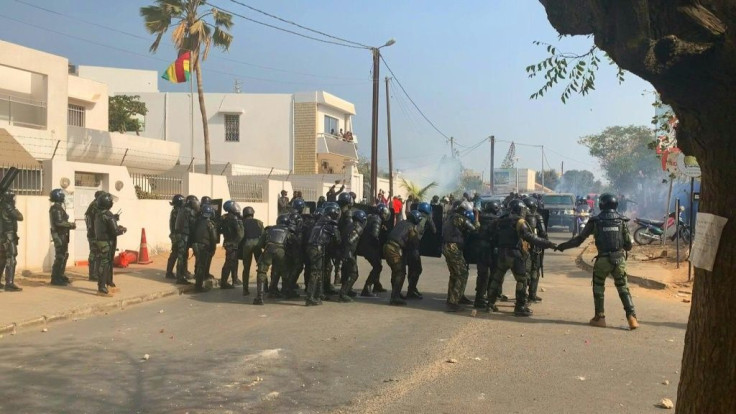 The Senegal government on Friday vowed to use "all means necessary" to return order after police fired tear gas in clashes with supporters of opposition leader Ousmane Sonko as the interior minister said four people had died.