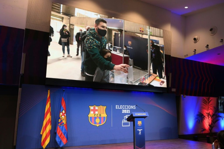 The image of Barcelona's Argentinian forward Lionel Messi voting is displayed at Camp Nou.