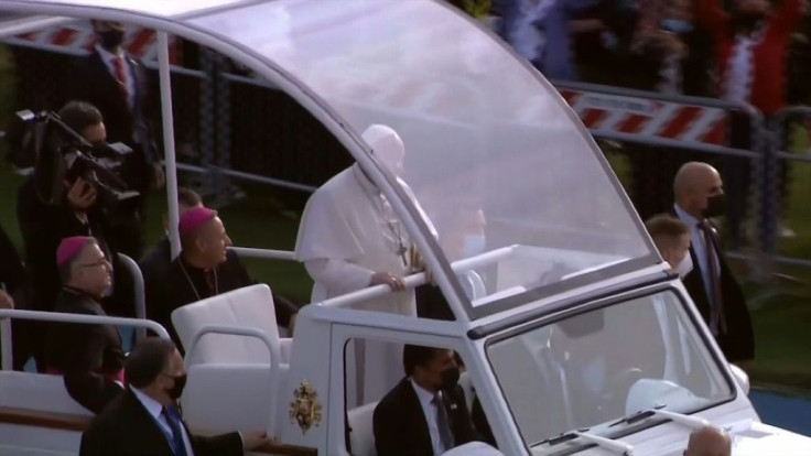 Pope Francis arrives at the celebrated mass on Sunday with several thousand worshippers spread across a stadium in the Kurdistan regional capital of Arbil, the largest liturgy of his trip to pandemic-hit Iraq.