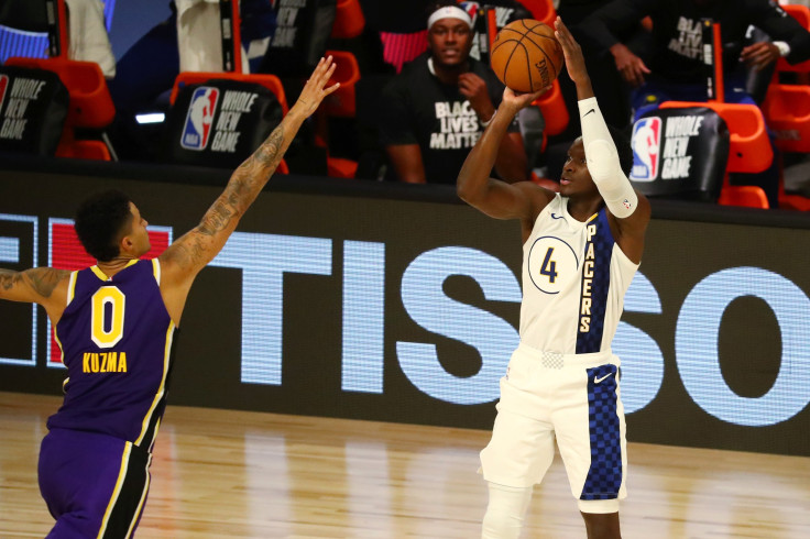  Victor Oladipo #4 of the Indiana Pacers shoots the ball against Kyle Kuzma #0 of the Los Angeles Lakers