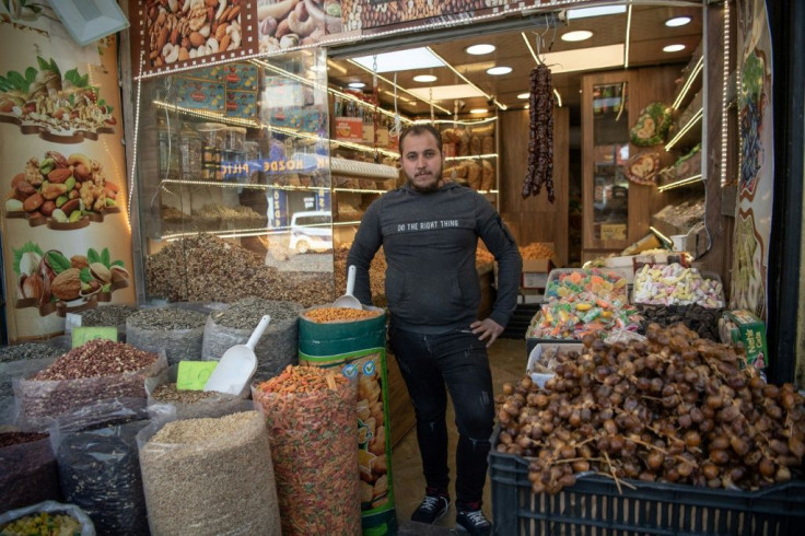 Dried fruit vendor Zakaria al-Sabbagh, 23, is among more than 3.6 million Syrians who fled the conflict and settled in Turkey