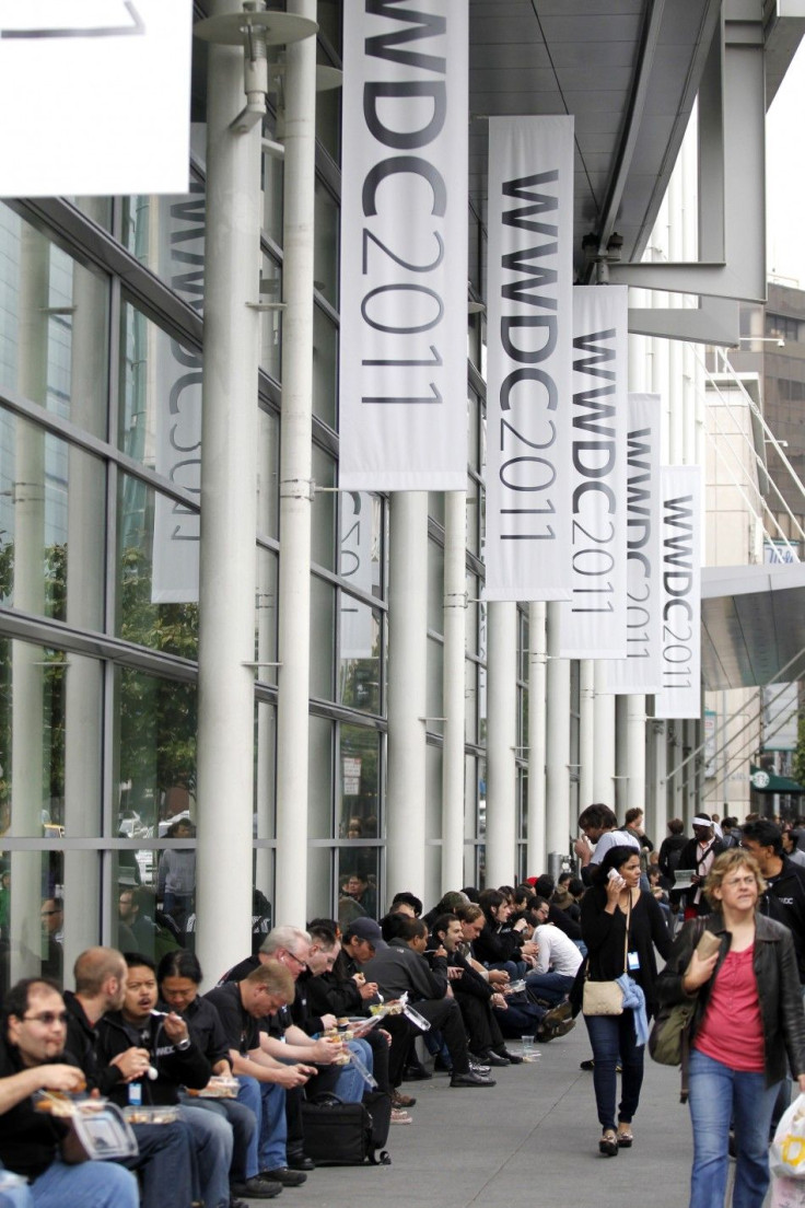 Attendees eat outside the Moscone West Convention Center following the keynote address at the Apple Worldwide Developers Conference in San Francisco