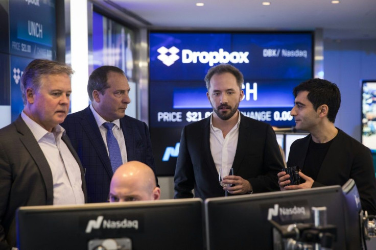 Dropbox CEO Drew Houston (2nd from R) and Dropbox co-founder Arash Ferdowsi are seen at Dropbox's initial public offering at Nasdaq MarketSite, March 23, 2018