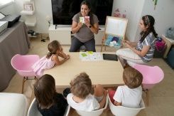 Milena Mendosa, 25, helps her daughter, Brithany, 8, with her homework, but says the added burden of playing teacher on top of two jobs can be too much