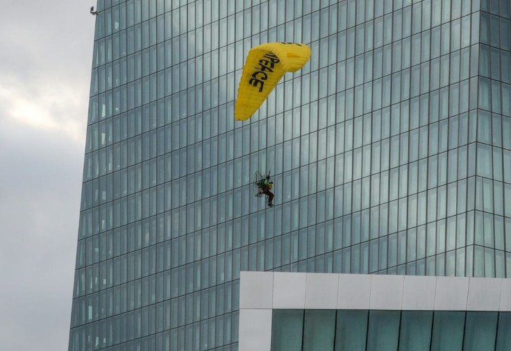 Greenpeace charged the European Central Bank had approved â¬300 billion in loan collaterals from corporate giants including 'polluters' Shell, Total, Eni, OMV and Repsol