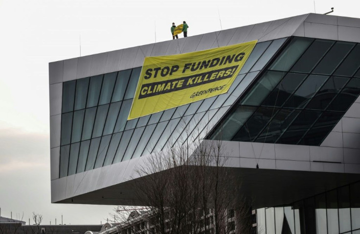 Greenpeace urged the ECB to support the transition to renewable energy and to align itself with the Paris climate agreement