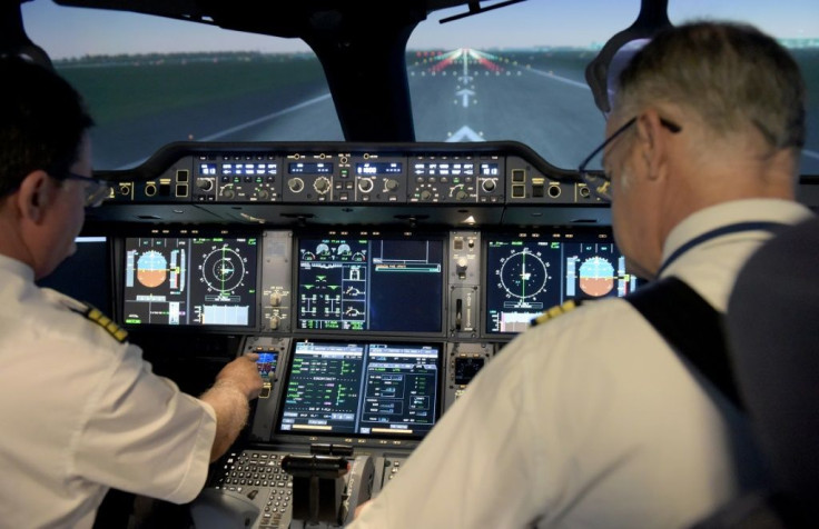 It looks and feels completely real but here two Air France pilots prepare for take-off on a flight simulator, used by airlines to keep their crews up to standard during the pandemic