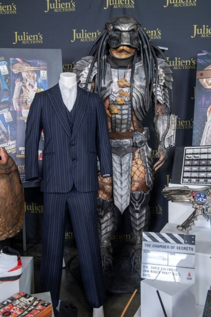 Al Pacino's "Tony Montana" screen-matched three-piece pinstripe suit from "Scarface" and Ian White's Predator Costume from "Alien vs Predator" are seen at the the auction preview in Beverly Hills, California, March 10, 2021