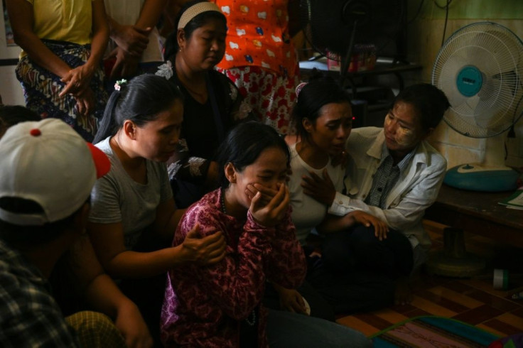 Relatives of slain Myanmar protester Chit Min Thu react after learning that security forces shot him in the head while demonstrating against the military regime in Yangon