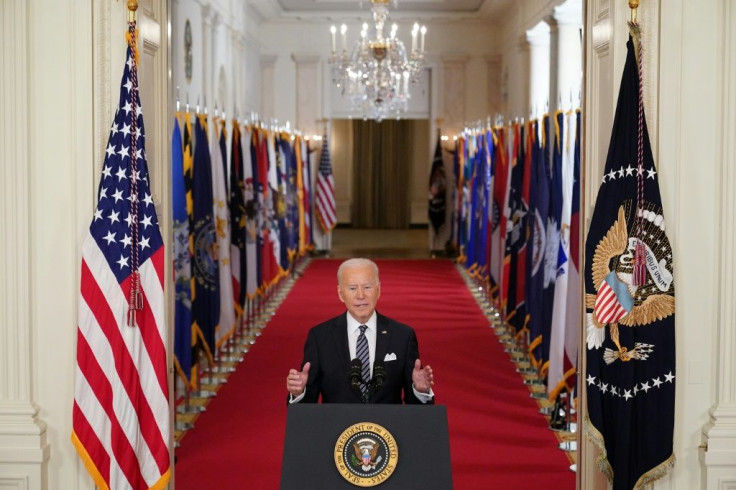 In a speech to mark a year since the pandemic struck the United States, Joe Biden said he hoped Americans would be able to mark Independence Day with friends and family as the vaccine is rolled out