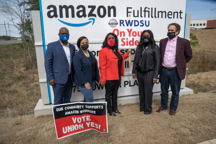 US lawmakers, left to right, Jamaal Bowman, Nikema Williams, Terri Sewell, Cori Bush, and Andy Levin visit the Amazon Fulfillment Center after meeting on March 5 with workers and organizers involved in a contested unionization effort
