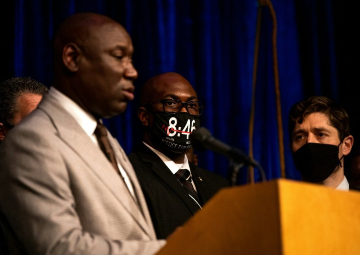 Attorney Ben Crump (L) announces that the city of Minneapolis has reached a $27 million settlement with the family of George Floyd as  Floyd's brother Philonise (C) and Mayor Jacob Frey (R) look on