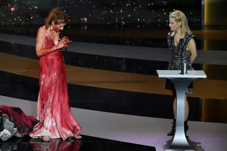 Actress Corinne Masiero (L) appeared to present the award for best costume, later stripping naked on stage in support of artists impacted by lockdowns