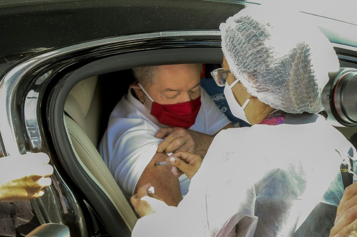 Brazilian ex-president Luiz Inacio Lula da Silva receives a dose of Sinovac's CoronaVac vaccine in Sao Bernardo do Campo, near Sao Paulo, on March 13, 2021