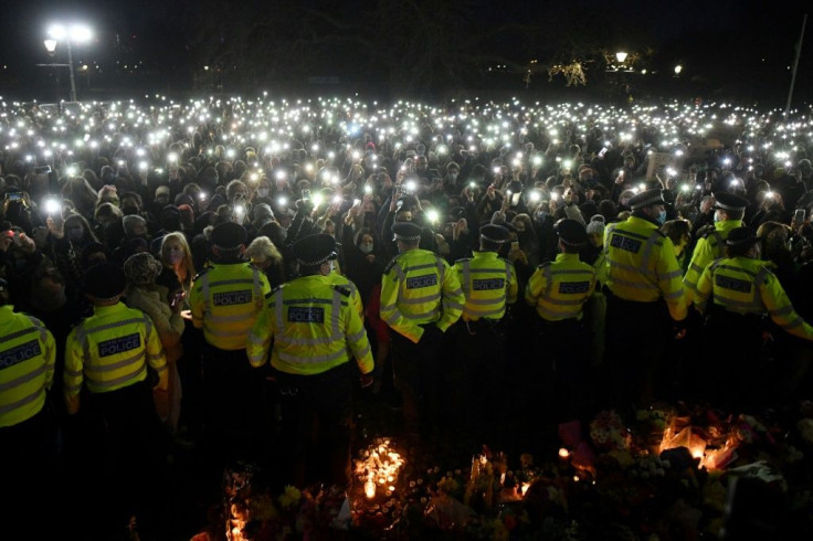 Mourners shouted "shame on you" at police, with tensions running high as a man arrested in connection with Everard's murder is an officer