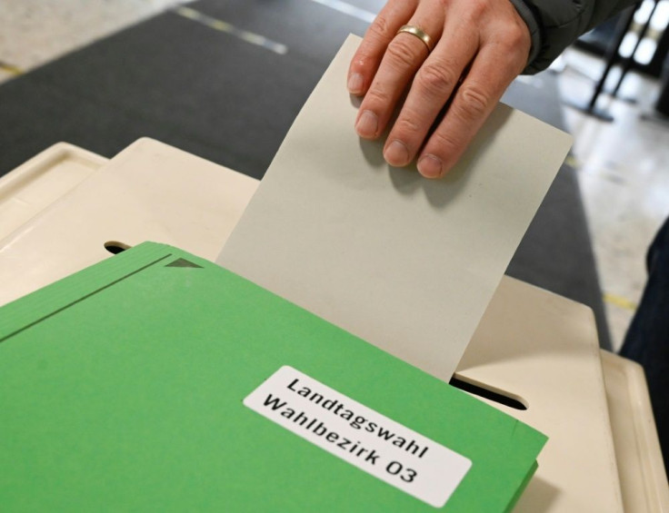 A voter casts his ballot for the state elections in the southern German federal state of Baden-Wuerttemberg