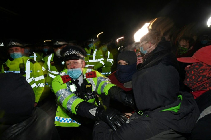 Officers scuffled with some members of the hundreds-strong crowd that gathered despite coronavirus restrictions