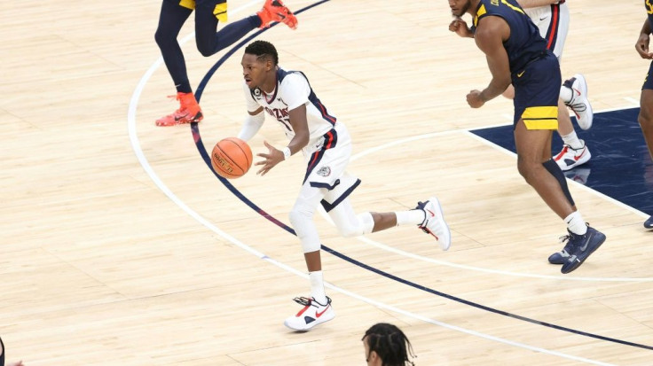 French guard Joel Ayayi dribbles up the court for the unbeaten top-ranked Gonzaga Bulldogs, who are a top seed for the NCAA basketball tournament, also known as March Madness