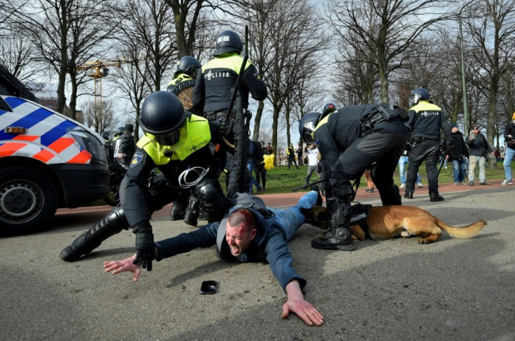 Police used water cannon and canine teams to break up anti-Rutte protests on the eve of voting