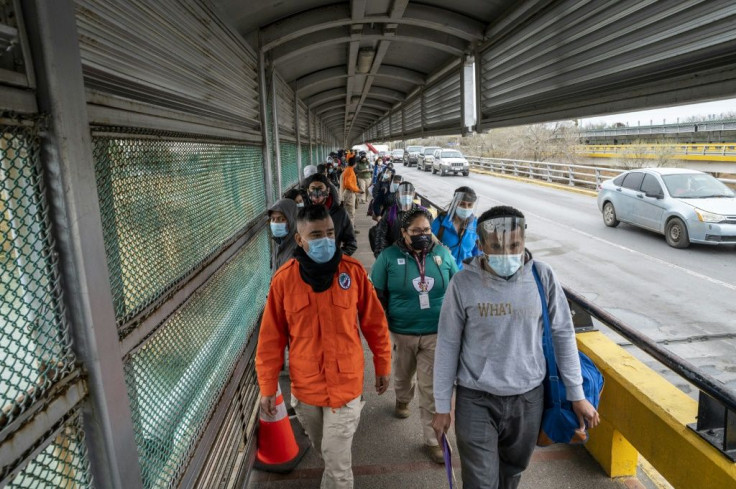 Migrants approach the US border on Gateway International Bridge in Brownsville, Texas on March 2, 2021