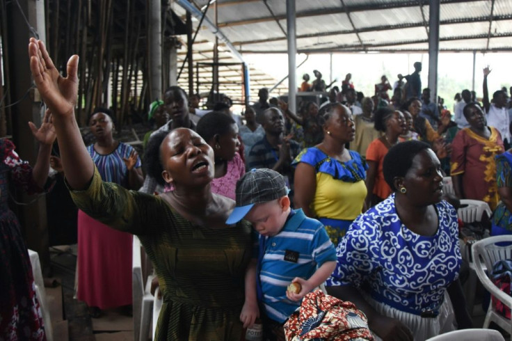 People attend Sunday mass without masks or social distancing at a church in  Dar es Salaam