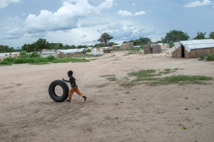 A child plays with a car tire in the Tara Tara district of Matuge, northern Mozambique. The area functions as a center for internally displaced persons who fled their communities due to attacks by armed insurgents in the northern part of the Cabo Delgado