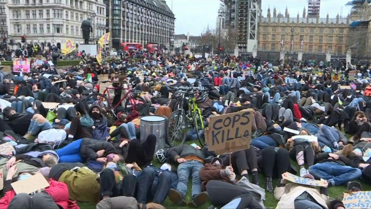 Crowds gather in Parliament Square against the police response to a vigil held marking the death of Sarah Everard. The Metropolitan Police has defended its handling of the event on Clapham Common after male officers were seen physically restraining female