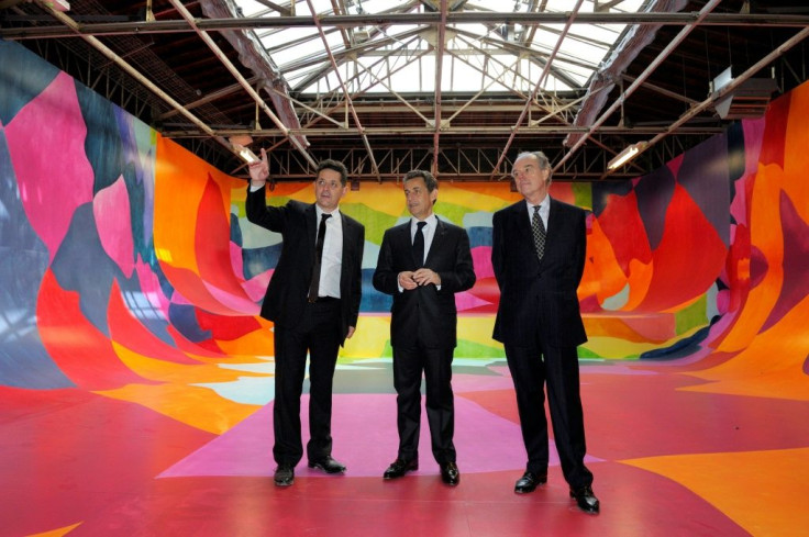 Former French president Nicolas Sarkozy (c) at the Palais de Tokyo in April 2012 after it was renovated by Anne Lacaton and Jean-Philippe Vassal