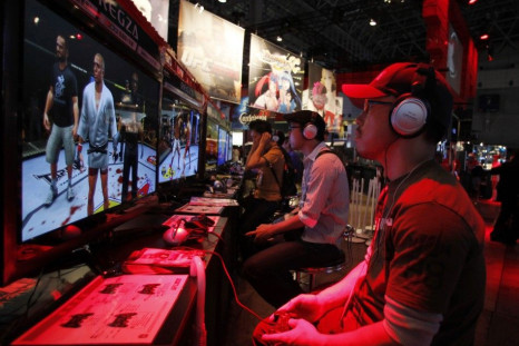 Visitors try out game software maker Konami Corp&#039;s new &quot;UFC Undisputed 2010&quot; at Tokyo Game Show in Chiba, east of Tokyo