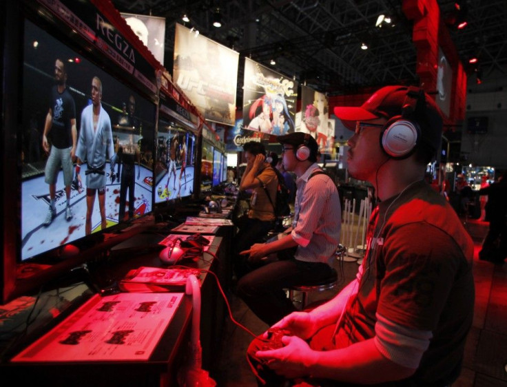 Visitors try out game software maker Konami Corp&#039;s new &quot;UFC Undisputed 2010&quot; at Tokyo Game Show in Chiba, east of Tokyo