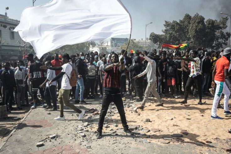 Thousands of young protesters also looted shops, hurled stones at police and torched cars during demonstrations