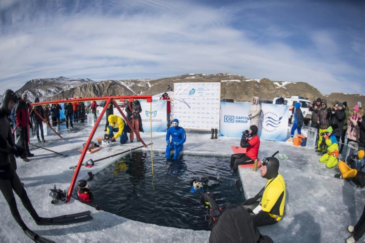 Clad in blue diving gear, Molchanov dropped into a hole in the Baikal ice before coming back up