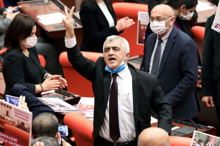 Turkish member of Parliament Omer Faruk Gergerlioglu (C) has long been a thorn in the side of President Recep Tayyip Erdogan's government