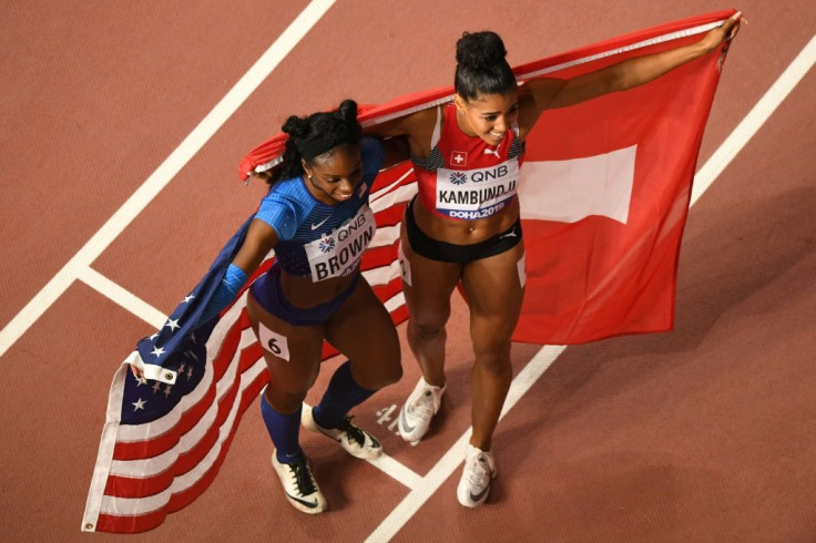 Hand of friendship: Brittany Brown celebrated with fellow 200m medallist Mujinga Kambundji of Switzerland at the  2019 World Championships
