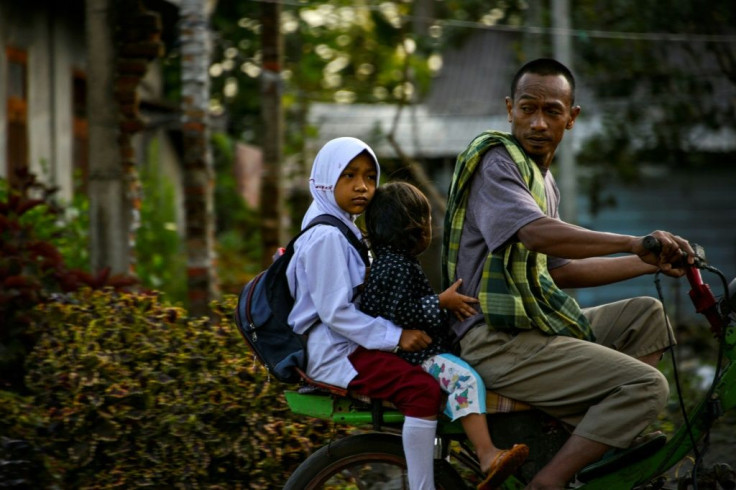 Schoolgirls, female teachers and civil servants across Indonesia are often forced or pressured to wear Islamic head coverings, according to Human Rights Watch