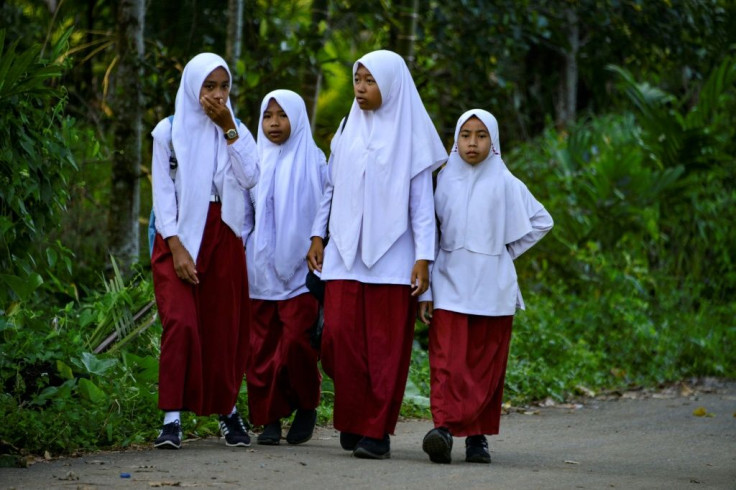 Schools across Indonesia have long used a combination of psychological pressure, public humiliation, and sanctions to persuade girls to wear hijab, HRW says